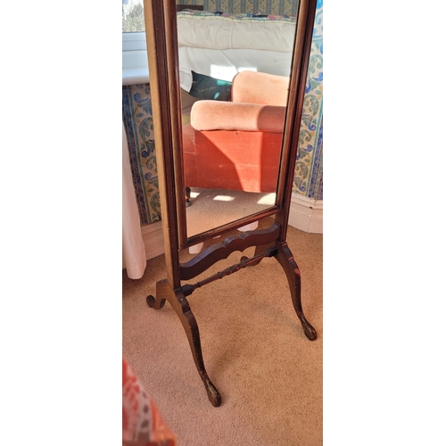 88 - A QUEEN ANNE STYLE MAHOGANY FRAMED CHEVAL DRESSING MIRROR, with the tall arched mirror held up betwe... 