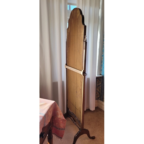 88 - A QUEEN ANNE STYLE MAHOGANY FRAMED CHEVAL DRESSING MIRROR, with the tall arched mirror held up betwe... 