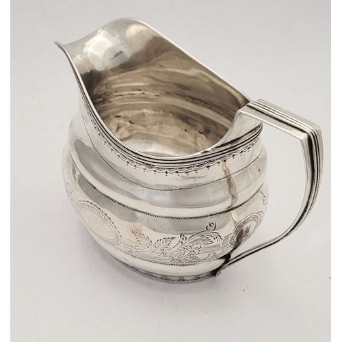 9 - A GOOD GEORGE III BRIGHT CUT CORK SILVER CREAM JUG, by S Greene Cork c.1800. With reeded border to t... 