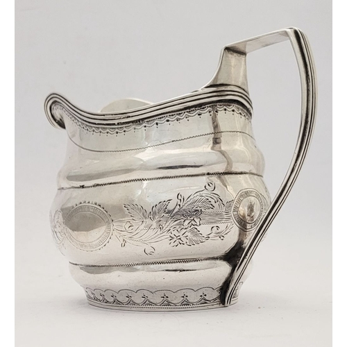 9 - A GOOD GEORGE III BRIGHT CUT CORK SILVER CREAM JUG, by S Greene Cork c.1800. With reeded border to t... 