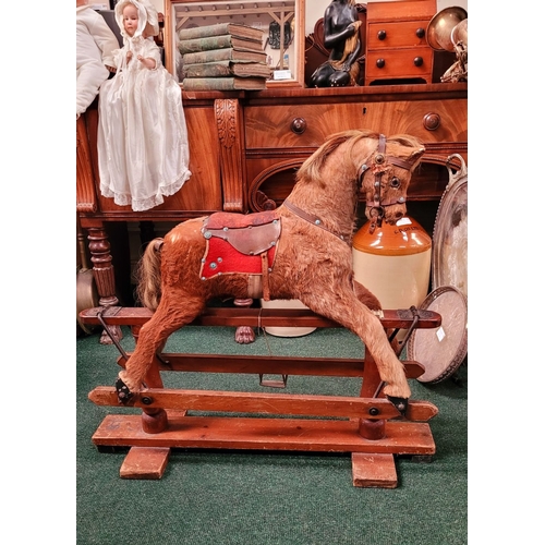 183 - A VINTAGE EARLY 20TH CENTURY AYRES HIDE COVERED ROCKING HORSE, the hide/hair covered horses rarer th... 