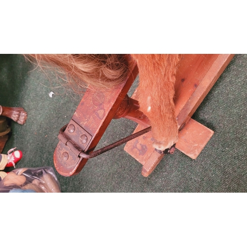 183 - A VINTAGE EARLY 20TH CENTURY AYRES HIDE COVERED ROCKING HORSE, the hide/hair covered horses rarer th... 