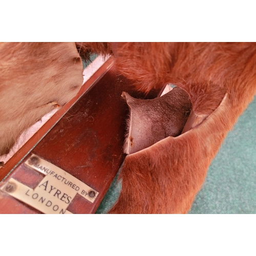 183 - A VINTAGE EARLY 20TH CENTURY AYRES HIDE COVERED ROCKING HORSE, the hide/hair covered horses rarer th... 