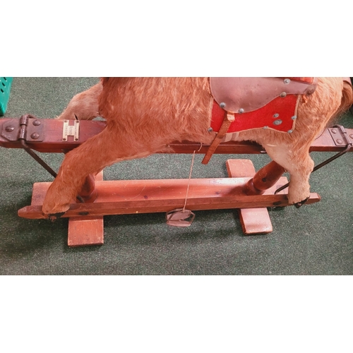 183 - A VINTAGE EARLY 20TH CENTURY AYRES HIDE COVERED ROCKING HORSE, the hide/hair covered horses rarer th... 