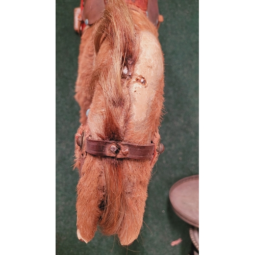 183 - A VINTAGE EARLY 20TH CENTURY AYRES HIDE COVERED ROCKING HORSE, the hide/hair covered horses rarer th... 