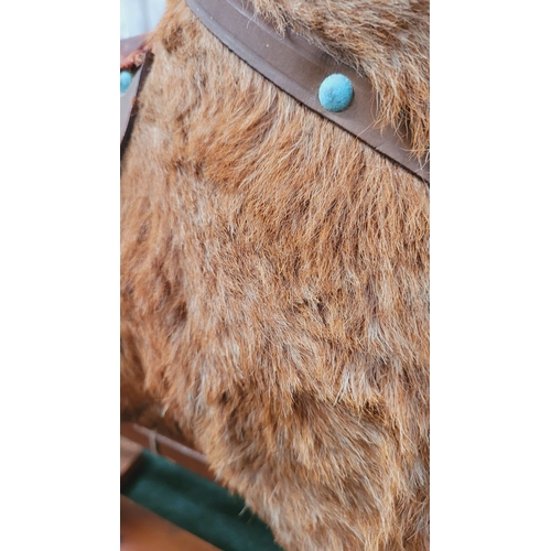 183 - A VINTAGE EARLY 20TH CENTURY AYRES HIDE COVERED ROCKING HORSE, the hide/hair covered horses rarer th... 