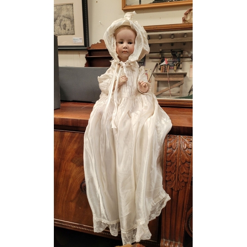 184 - A VINTAGE GERMAN MADE BISQUE COMPOSITE JOINTED DOLL; the delicately created facial features of this ... 