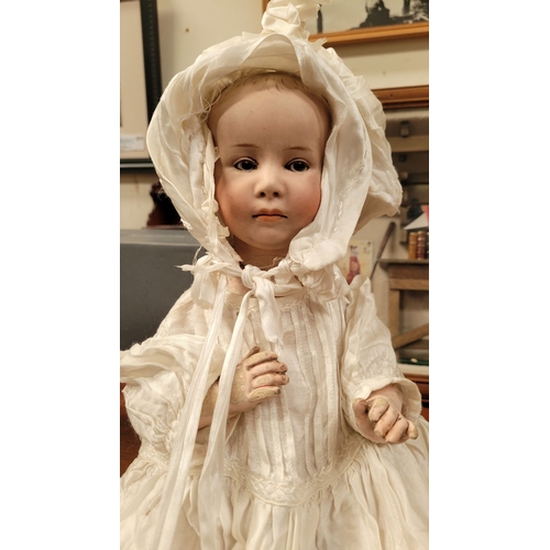 184 - A VINTAGE GERMAN MADE BISQUE COMPOSITE JOINTED DOLL; the delicately created facial features of this ... 