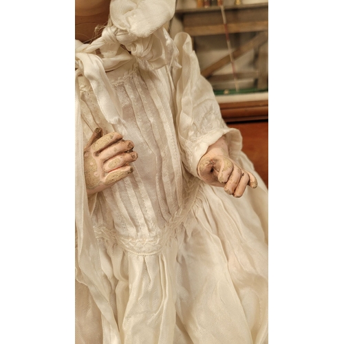 184 - A VINTAGE GERMAN MADE BISQUE COMPOSITE JOINTED DOLL; the delicately created facial features of this ... 