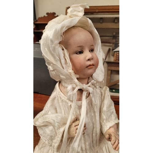 184 - A VINTAGE GERMAN MADE BISQUE COMPOSITE JOINTED DOLL; the delicately created facial features of this ... 
