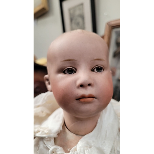184 - A VINTAGE GERMAN MADE BISQUE COMPOSITE JOINTED DOLL; the delicately created facial features of this ... 