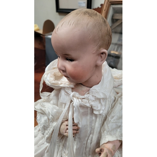 184 - A VINTAGE GERMAN MADE BISQUE COMPOSITE JOINTED DOLL; the delicately created facial features of this ... 