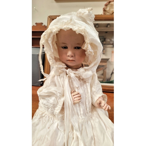 184 - A VINTAGE GERMAN MADE BISQUE COMPOSITE JOINTED DOLL; the delicately created facial features of this ... 