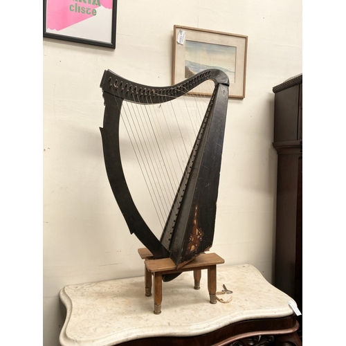 185 - A VINTAGE HARDWOOD IRISH HARP, 28 string harp. Complete with hardwood stand with brass capped feet. ... 