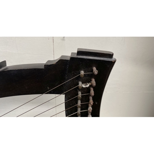 185 - A VINTAGE HARDWOOD IRISH HARP, 28 string harp. Complete with hardwood stand with brass capped feet. ... 