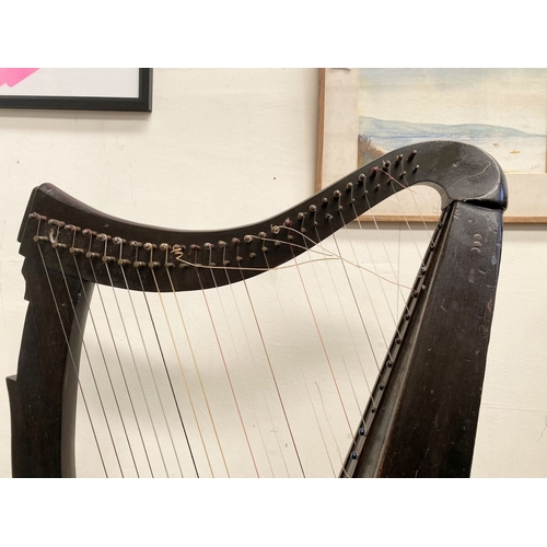 185 - A VINTAGE HARDWOOD IRISH HARP, 28 string harp. Complete with hardwood stand with brass capped feet. ... 