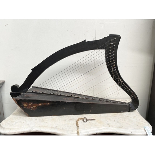 185 - A VINTAGE HARDWOOD IRISH HARP, 28 string harp. Complete with hardwood stand with brass capped feet. ... 