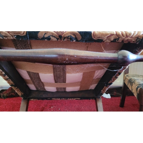 187 - A PAIR OF LOW RISE OR CHILDREN’S VINTAGE ARMCHAIRS, with upholstery to the back and seat. Raised on ... 