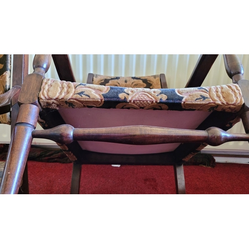 187 - A PAIR OF LOW RISE OR CHILDREN’S VINTAGE ARMCHAIRS, with upholstery to the back and seat. Raised on ... 