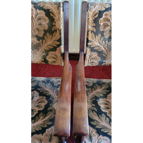 187 - A PAIR OF LOW RISE OR CHILDREN’S VINTAGE ARMCHAIRS, with upholstery to the back and seat. Raised on ... 