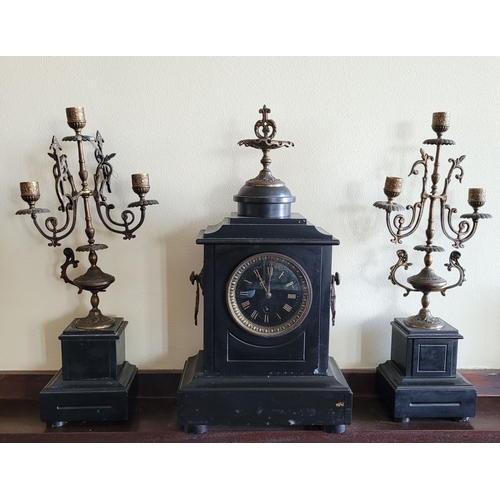 194 - A HEAVY BLACK SLATE MANTEL CLOCK WITH CANDELABRA, the candelabra with three candle holders is decora... 
