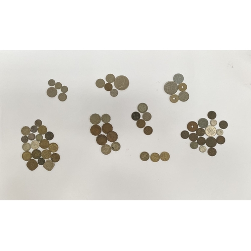 200 - A COLLECTION OF WORLDWIDE COINS, to include British India George V 2 Annas coin, British Threepence ... 