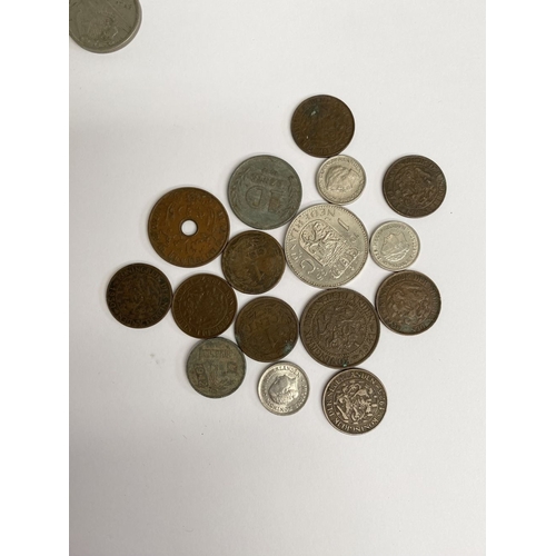 200 - A COLLECTION OF WORLDWIDE COINS, to include British India George V 2 Annas coin, British Threepence ... 
