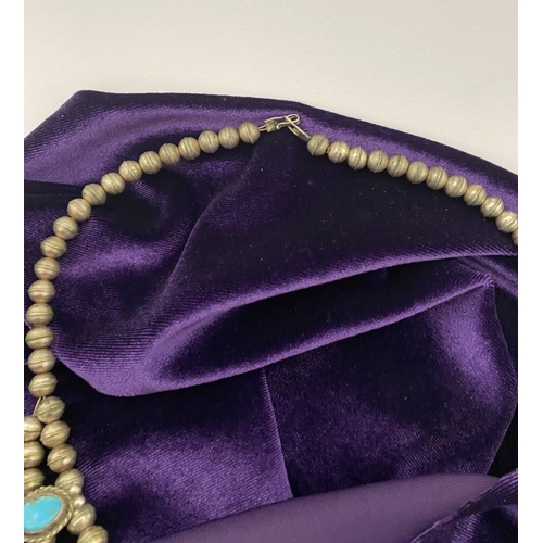 215 - A VINTAGE NAVAJO STERLING SILVER TURQUOISE SQUASH BLOSSOM NECKLACE, with two rows of beads to neckla... 