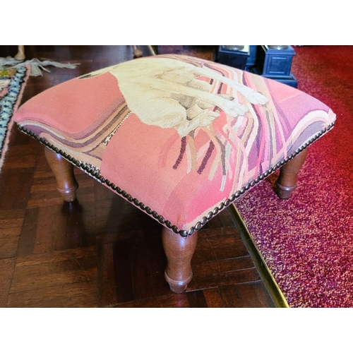 222 - A LOW RISE FRENCH FOOT STOOL, with upholstered top depicting a terrier, raised on turned leg finishe... 