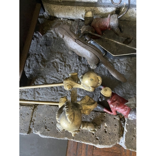 225 - A DECORATIVE BRASS FIRE IMPLEMENTS SET, to include a pair of andirons, shovel, poker and tongs. All ... 