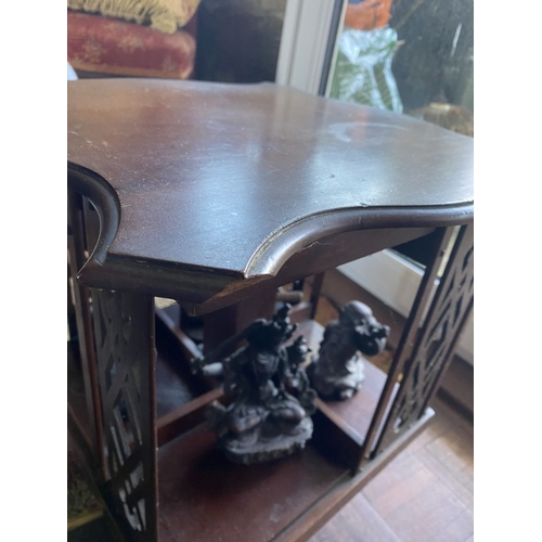 226 - A NEAT SIZED MAHOGANY REVOLVING BOOKCASE, the top with shaped edge and stepped border, above bookcas... 