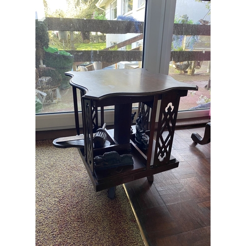 226 - A NEAT SIZED MAHOGANY REVOLVING BOOKCASE, the top with shaped edge and stepped border, above bookcas... 