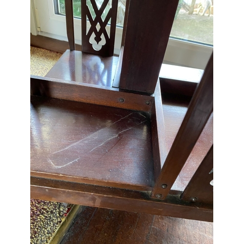 226 - A NEAT SIZED MAHOGANY REVOLVING BOOKCASE, the top with shaped edge and stepped border, above bookcas... 