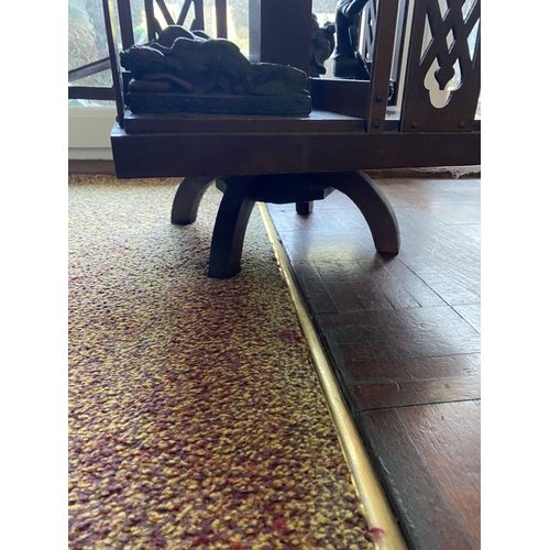 226 - A NEAT SIZED MAHOGANY REVOLVING BOOKCASE, the top with shaped edge and stepped border, above bookcas... 