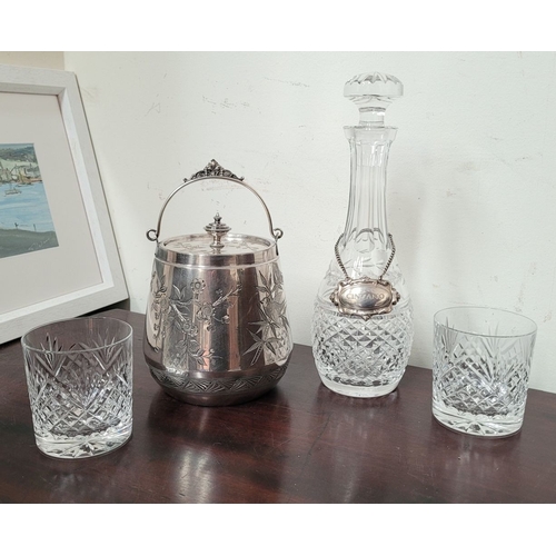 235 - A WATERFORD CRYSTAL DECANTER, along with a pair of glasses and a lovely silver plate ice container –... 