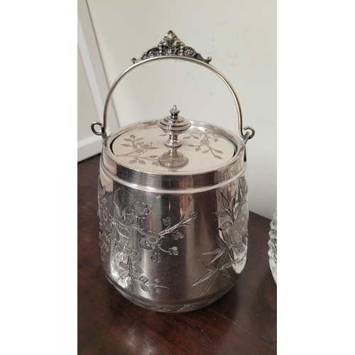 235 - A WATERFORD CRYSTAL DECANTER, along with a pair of glasses and a lovely silver plate ice container –... 