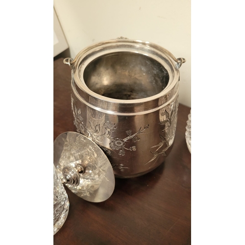 235 - A WATERFORD CRYSTAL DECANTER, along with a pair of glasses and a lovely silver plate ice container –... 