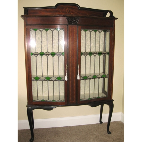243 - A MAHOGANY INLAID SERPENTINE GLAZED DISPLAY CABINET, the raised gallery to back with inlaid detail, ... 