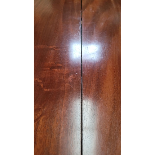 289 - A LARGE IRISH REGENCY MAHOGANY TIP-UP DINING TABLE, the table top made from two pieces of stunning m... 