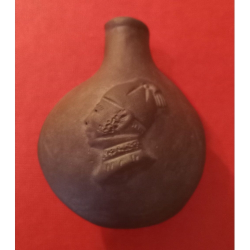 184 - A 19TH CENTURY TERRACOTTA SNUFF BOTTLE, c.1880, traditional form with carved male bust in relief to ... 