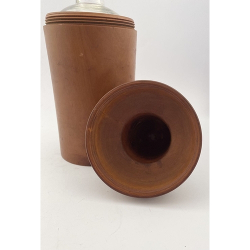 185 - AN ANTIQUE BOXWOOD CASED APOTHECARY/PERFUME BOTTLE, glass bottle with stopper numbered to base. The ... 