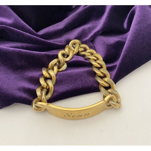 189 - A GOLD-TONE ENGRAVED MEN'S ID BRACELET, engraved ‘Sean’ to front, ‘2 Deacon Close St. Albans’ to rev... 