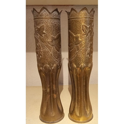 192 - A DECORATIVE PAIR OF WORLD WAR I TRENCH ART ARTILLERY SHELL CASES, with shaped rim, the body decorat... 