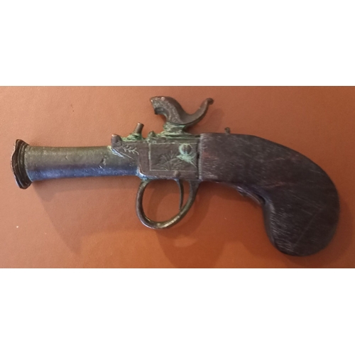 193 - A GEORGIAN BLACK POWDER PERCUSSION PISTOL RELIC. Dimensions: 16cm long overall.