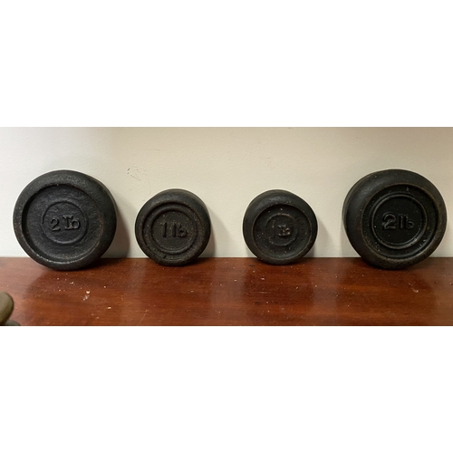 197 - A SET OF BRASS WEIGHTS ALONG WITH CAST IRON WEIGHTS.