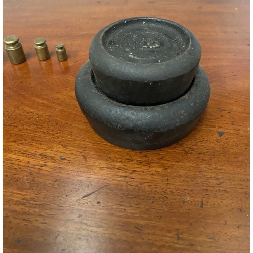 197 - A SET OF BRASS WEIGHTS ALONG WITH CAST IRON WEIGHTS.