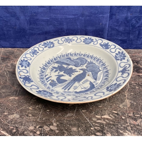 199 - A CHINESE BLUE AND WHITE 'SWATOW' CHARGER of deep circular form, resting atop short foot, late Ming ... 