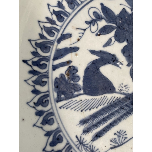 199 - A CHINESE BLUE AND WHITE 'SWATOW' CHARGER of deep circular form, resting atop short foot, late Ming ... 