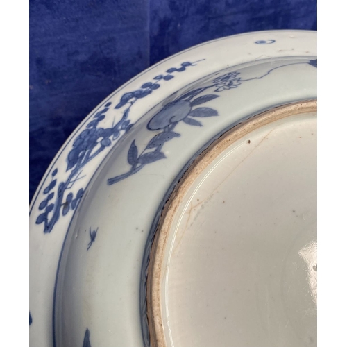 199 - A CHINESE BLUE AND WHITE 'SWATOW' CHARGER of deep circular form, resting atop short foot, late Ming ... 