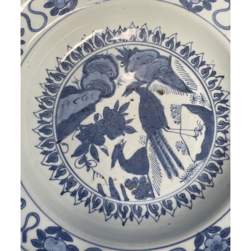 199 - A CHINESE BLUE AND WHITE 'SWATOW' CHARGER of deep circular form, resting atop short foot, late Ming ... 